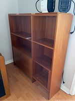 Front view of the retro wood cabinet showcasing upper open shelves and lower left hinged door section.