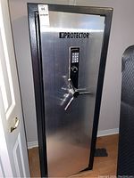 Front view of upright safe with closed door in room