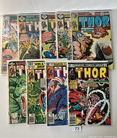 Photo showing nine vintage Thor comics featuring various cover art, all bagged and boarded.