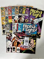 Photo shows eleven Marvel Alpha Flight comic books, issues 39, 40, then 45 through 51, all with colorful covers and Marvel branding, arranged with covers visible.