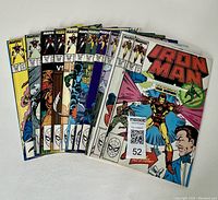 Comic issues #224, #226 to #235 arranged together showing the front covers with Iron Man prominently featured in classic comic art style.