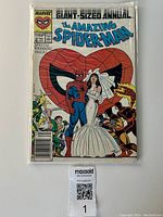 Front cover photo showing the entire comic book sealed in a protective bag with backing board, displaying Spider-Man and a bride in wedding dress with other characters in background.