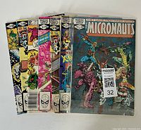 Set of 7 Marvel The Micronauts comic books fanned out showing front covers with various characters and issue information.