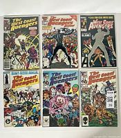 Overhead view of all 6 comic books, showing varied covers and characters.