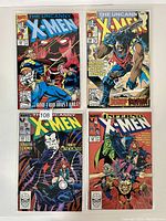 Four Marvel The Uncanny X-Men comic books displayed face-up, showing colorful front covers.