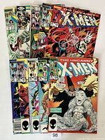 Twelve Marvel The Uncanny X-Men comic books fanned out showing front covers including a signed issue #184.