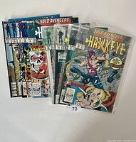 Eight Marvel Solo Avengers comic books laid out with front covers visible, showing characters Hawkeye and Mockingbird, mixed issue numbers, and colorful comic style covers.