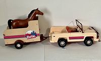 Side view of Barbie Jeep towing horse trailer with brown horse inside, showing condition and decals