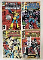 Front covers of four Marvel Transformers comic books showing colorful superhero style artwork of Transformers characters