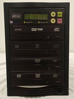 Front view of the 3-tray ATECi duplicator tower showing display, buttons, and disc trays