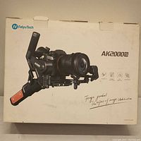 Box showing FeiyuTech AK2000S camera gimbal with product image and branding.