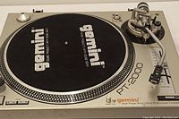 Full top view of the Gemini PT-2000 turntable showing platter with black slipmat and tonearm assembly.