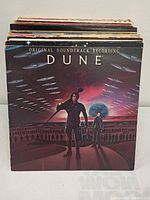 Stack of vintage vinyl LPs with Dune cover at front