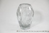 Front and side view of the heavy crystal vase showing size measurement with ruler and clear floral cut pattern on smooth crystal body.