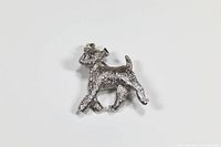 Front angled view of silver wire terrier brooch with detailed textured fur finish.