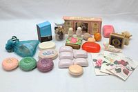 Full view of the soap assortment and figurines on a white background.