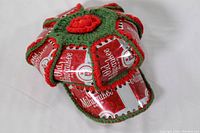 Front side of the Old Milwaukee beer hat showing crochet and beer labels