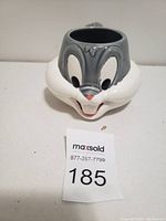 Front view showing full Bugs Bunny face with facial features and open mouth.