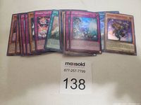 Original holographic Yugioh cards arranged in a row showcasing front designs with holographic foil and art.