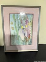 Framed pink iris print artwork by Beatrice Hogen showing the full piece including pink mat and silver frame.