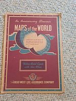 Cover of a 1942 anniversary souvenir map booklet by Great-West Life Assurance Company showing stylized globe and cover text.