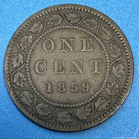 Reverse side of the 1859 Canadian Large Cent coin with denomination and date surrounded by a maple leaf wreath.