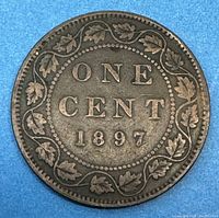 Reverse side of the 1897 Canadian large cent showing 'ONE CENT 1897' surrounded by maple leaves.