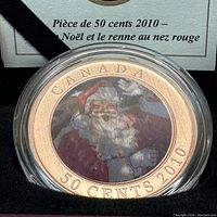 Close-up of the lenticular coin showing Santa Claus image with text CANADA 50 CENTS 2010 around the rim.