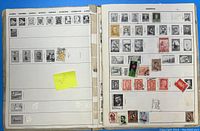 Open album pages showing stamps from Algeria, Andorra, Angola, Armenia, Ascension, Azerbaijan, Azores, and Argentina.
