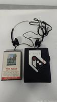 AIWA HS-J8 radio cassette player with Sony Walkman headphones attached and Pink Floyd 'Wish You Were Here' cassette tape alongside.