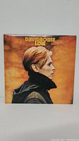 Front cover of the David Bowie Low vinyl LP album showing Bowie's profile and album title.