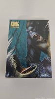 Front of sealed King Kong trading card pack showing King Kong in battle scene.