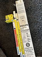 Photo showing Philips T8 fluorescent tube box and other bulb boxes including GE and Philips.