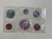 Photo shows the full set of 1967 Canadian coins sealed in original mint packaging with all six coins visible.