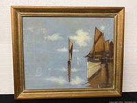 Full frontal view of framed pastel painting depicting sailboats on water under cloudy sky