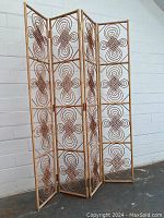 Three-quarter view of full screen showing all four hinged panels and woven design