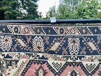 Close-up of border and pattern details showing pile and wear