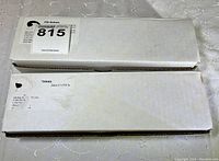 Two white cardboard boxes containing ITG Knives, labeled with product info and barcodes.
