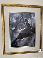 Full front view of the framed owl print showing gold frame, double matting, and the owl in forest scene.