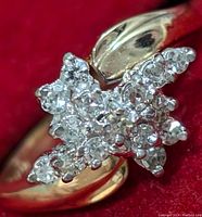 Close-up top view of the star-shaped diamond cluster on the ring