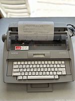 Top view of Brother SX-4000 typewriter showing keyboard and paper feed with typed page inserted.