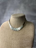 Front view of vintage 925 silver and abalone choker necklace on display bust, showing the three curved silver bands with abalone inlay.