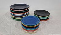 Stacked Fiesta Ware plates showing layered colors and size differences for dinner, salad, and dessert plates.