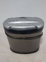 Front angle view of the heavy duty shredder showing the top controls and paper slot.