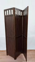 3-panel wooden room divider standing folded showing full height and design details
