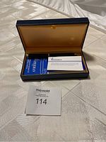 Waterman Ideal fountain pen in box with paperwork inside and lot number card in foreground