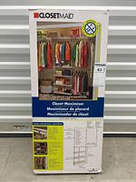Outer box of Closet Maid Closet Maximizer closet organizer showing brand, product name, an image of the organizer fully set up in a closet setting with hanging clothes and shelving.