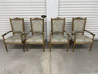 Front view of four armchairs side by side