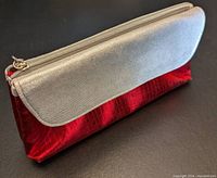 Brand new metallic silver and red textured cosmetic bag with zipper