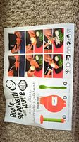 Instruction packaging showing the apple spaghetti wave spiralizer in orange with a green peeler, demonstrating spiralizing and julienne cutting with apples and other vegetables.